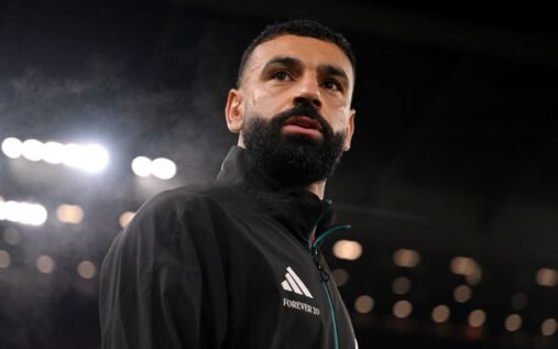 Mohamed Salah gesturing on the pitch during a Liverpool match at Anfield