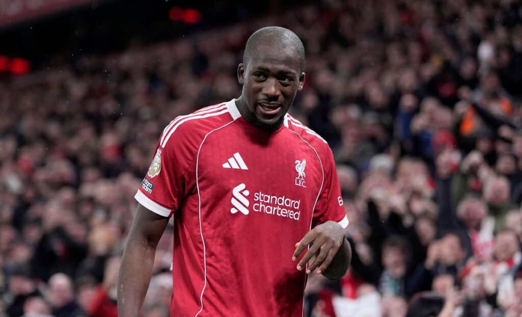 Ibrahima Konate gesturing on the pitch during a Liverpool match