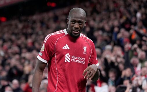 Ibrahima Konate gesturing on the pitch during a Liverpool match