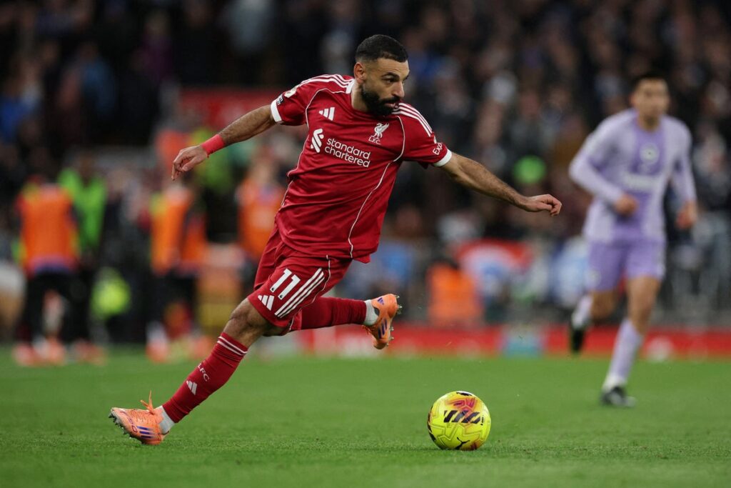 Mohamed Salah gesturing to teammates during a Premier League match at Anfield