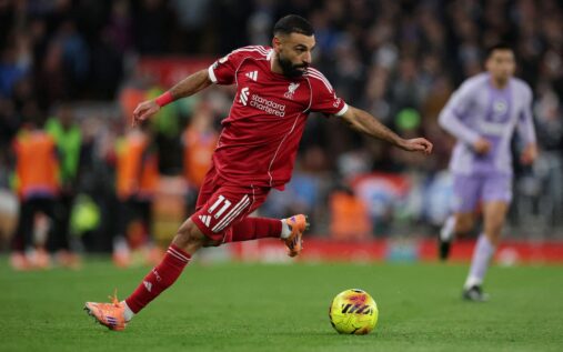 Mohamed Salah gesturing to teammates during a Premier League match at Anfield