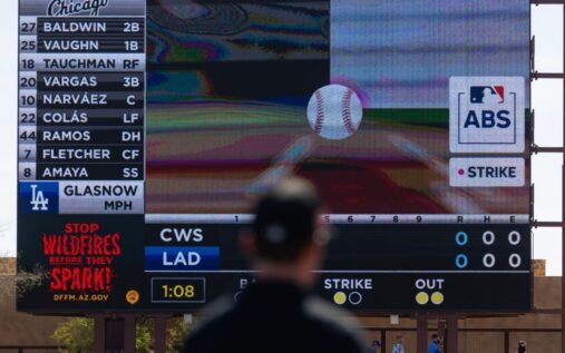 Close up of a Major League Baseball umpire and catcher behind home plate expecting a pitch