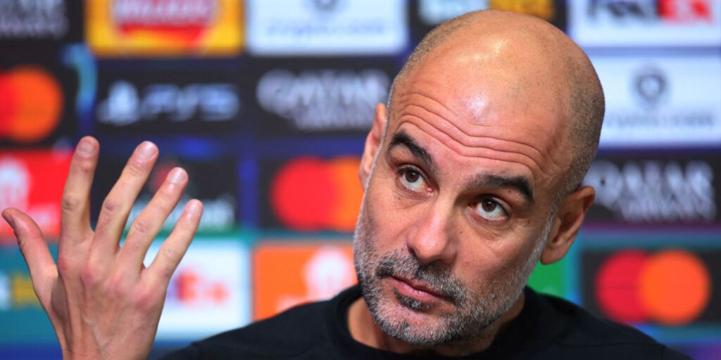 Manchester City manager Pep Guardiola looking pensive on the touchline during a Premier League match