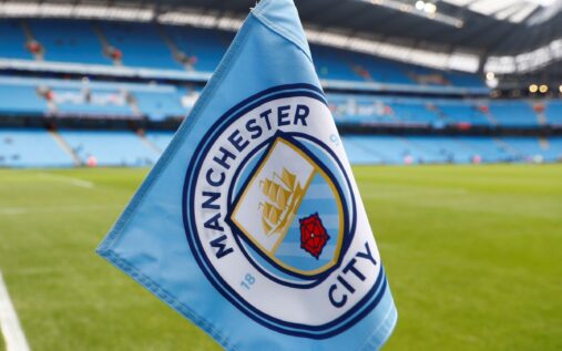 Manchester City badge on the Etihad Stadium exterior