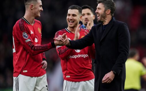 Thomas Tuchel smiling while wearing England training kit