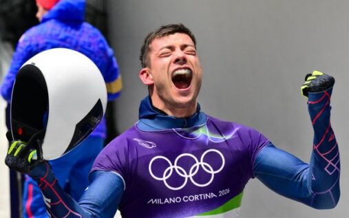 Matt Weston celebrating with a gold medal after the skeleton event at the Winter Olympics