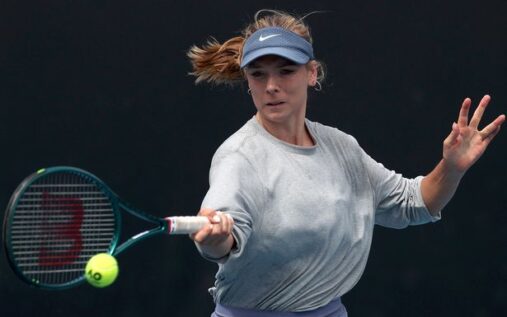 Katie Boulter preparing to hit a forehand during a hard court tennis match