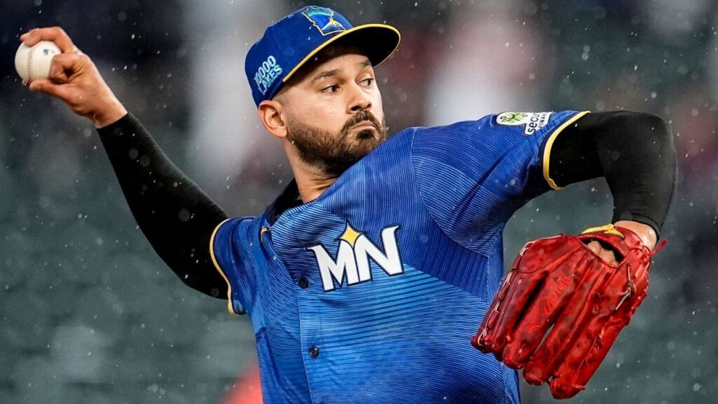 Minnesota Twins pitcher Pablo Lopez looking focused while preparing to throw a pitch during an MLB game