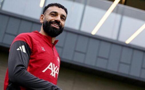 Mohamed Salah looking pensive on the pitch during a Liverpool match