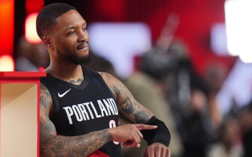 Damian Lillard shooting a basketball during the NBA All-Star 3-Point Contest wearing a Portland Trail Blazers jersey