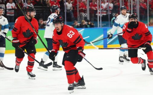 Nathan MacKinnon celebrating a goal for Team Canada during the Olympic semi-final against Finland