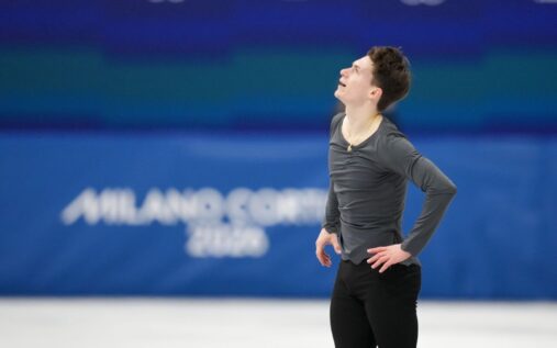 Maxim Naumov waving emotionally to the crowd at the Milano Ice Skating Arena after his free skate