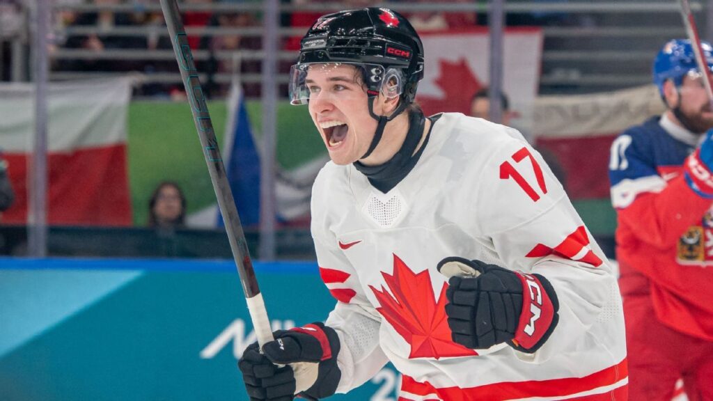 Macklin Celebrini celebrates scoring Canada's first goal against Czechia with teammates during the Olympic men's hockey tournament