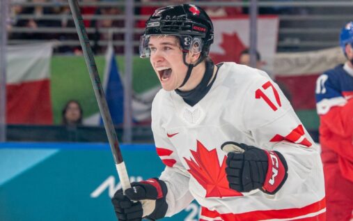 Macklin Celebrini celebrates scoring Canada's first goal against Czechia with teammates during the Olympic men's hockey tournament