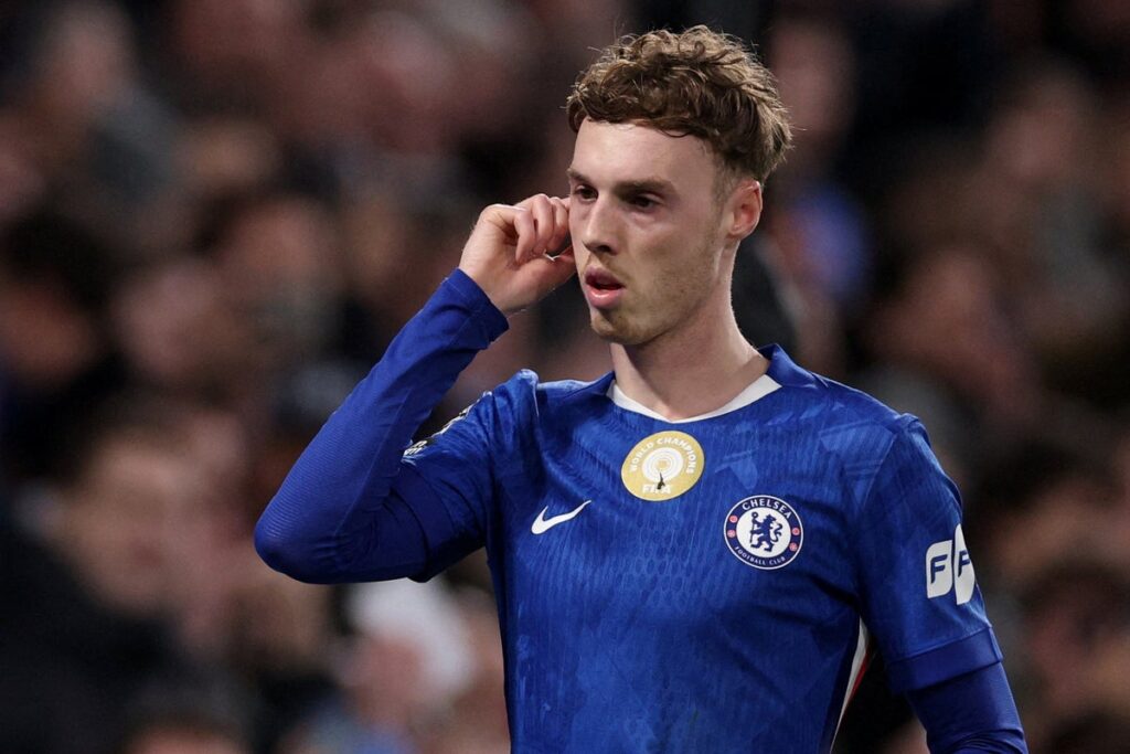 Chelsea forward Cole Palmer looking tired with hands on hips during a Premier League match