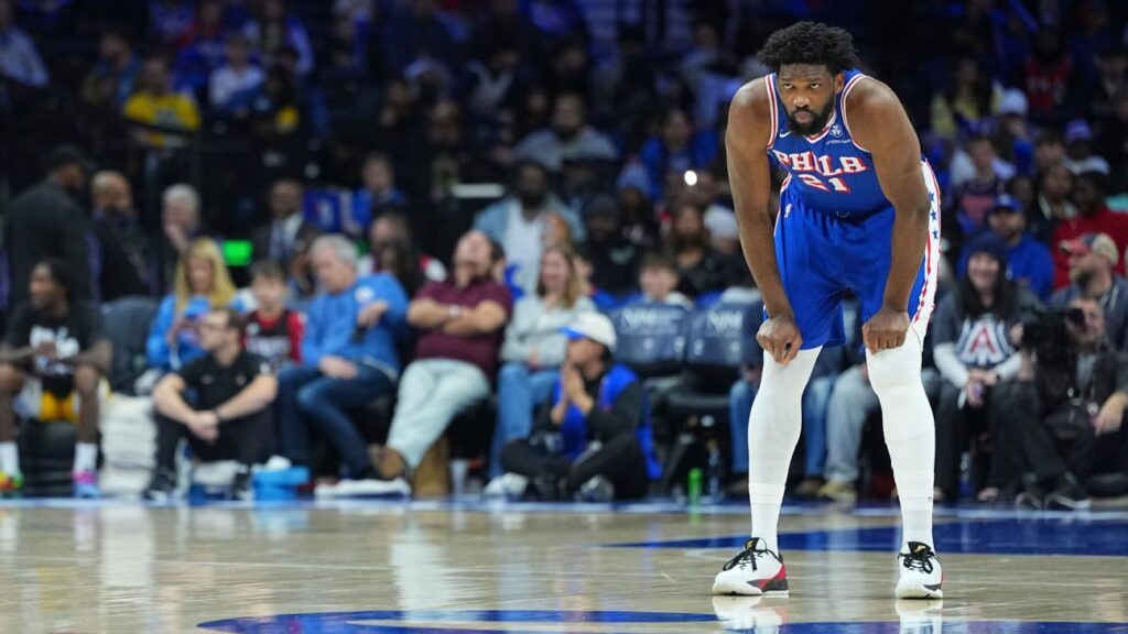 Philadelphia 76ers center Joel Embiid looking on from the court during an NBA game