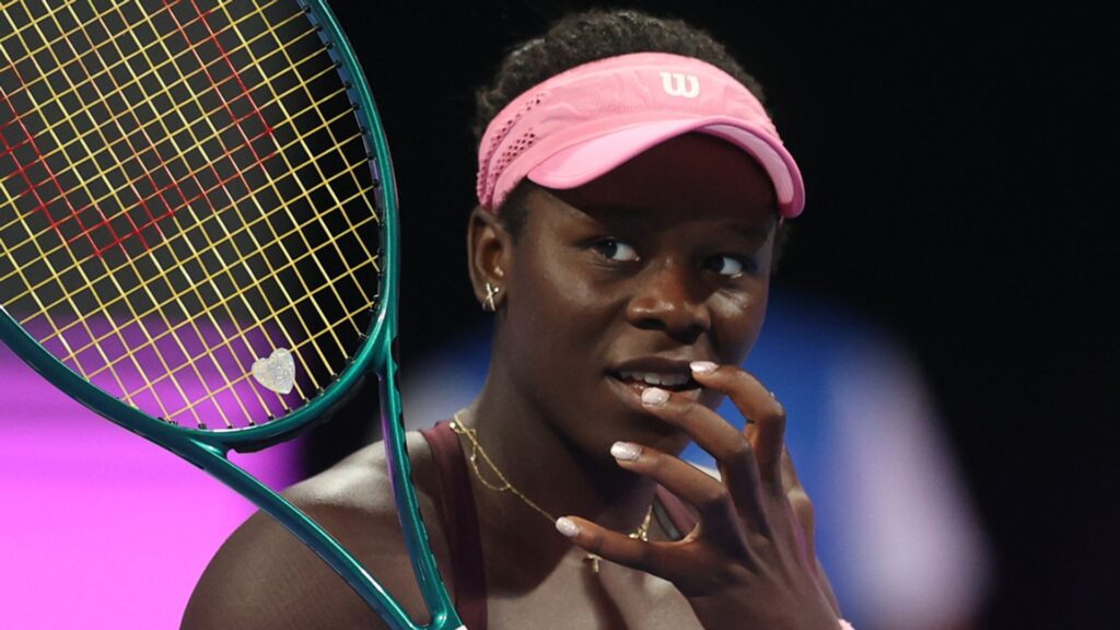Karolina Muchova celebrating with the Qatar Open trophy after defeating Victoria Mboko in the final