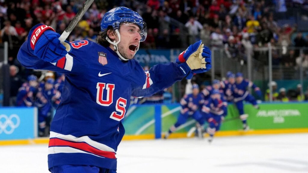 Quinn Hughes celebrating his overtime winning goal for Team USA against Sweden