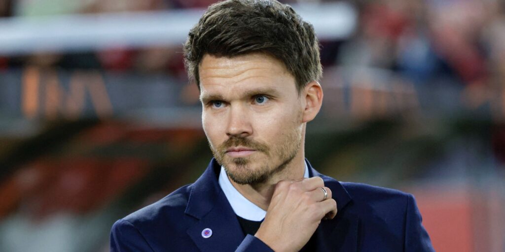 Mikey Moore applauding fans during a match for Rangers