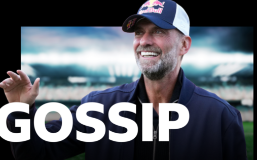 Jurgen Klopp smiling while wearing a Red Bull branded jacket