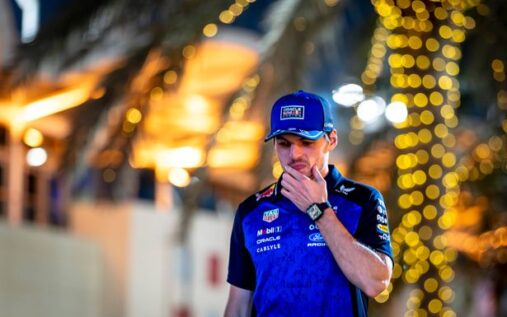 Max Verstappen walking through the paddock wearing Red Bull team kit ahead of the new Formula 1 season