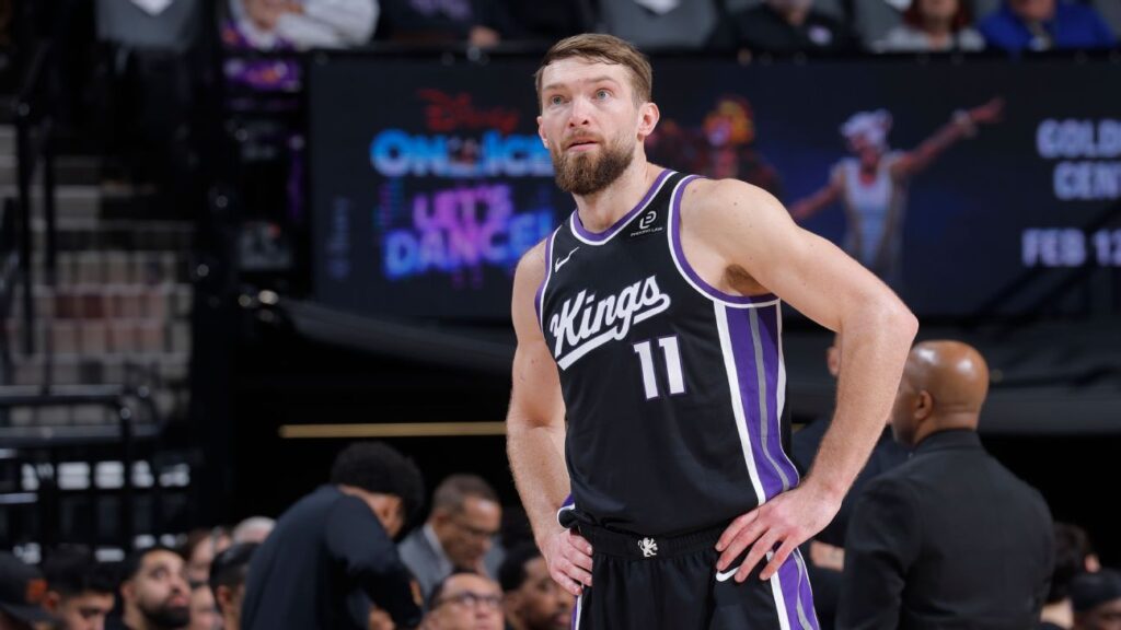 Sacramento Kings players Domantas Sabonis and Zach LaVine standing on the court during an NBA game
