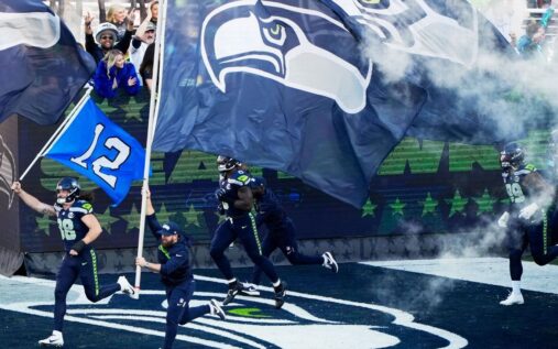 Seattle Seahawks players celebrating on the field