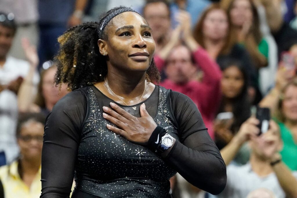 Serena Williams waving to the crowd on court during her last professional appearance at the US Open