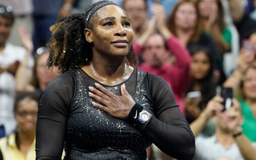 Serena Williams waving to the crowd on court during her last professional appearance at the US Open