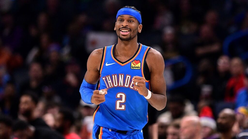 Shai Gilgeous-Alexander dribbling the ball for Oklahoma City Thunder during an NBA game