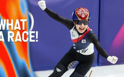 South Korea women's short track speed skating team celebrating with their flag after winning gold