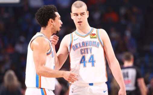 Nikola Topic in an Oklahoma City Thunder jersey dribbling the ball during his NBA debut against the Milwaukee Bucks