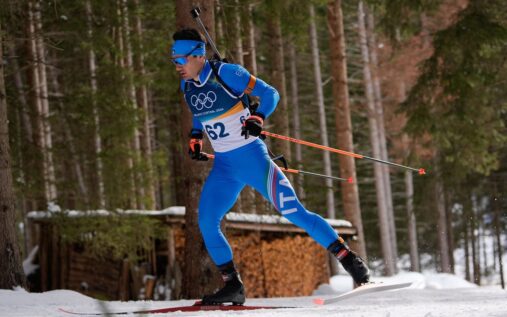 Tommaso Giacomel competing in a biathlon event wearing Italian national team kit