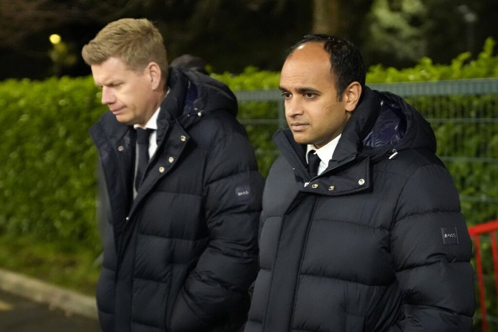 Exterior view of the Tottenham Hotspur Stadium showing the club crest