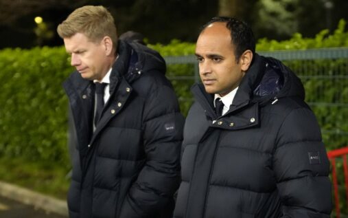 Exterior view of the Tottenham Hotspur Stadium showing the club crest