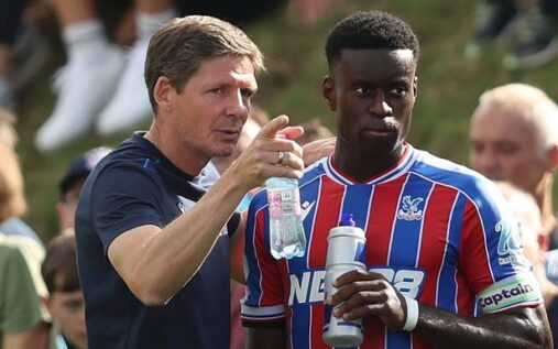 Marc Guehi gesturing on the pitch while wearing a Crystal Palace kit