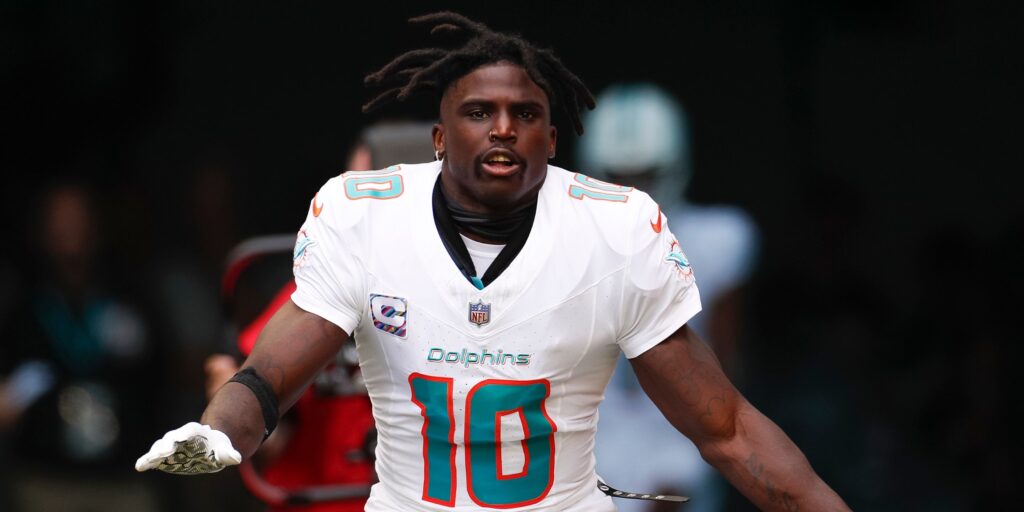 Tyreek Hill looking focused while wearing a Miami Dolphins uniform during an NFL game