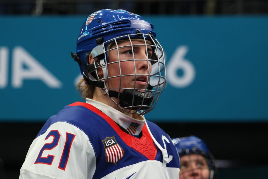 USA captain Hilary Knight skating with the puck during a women's ice hockey match against Canada