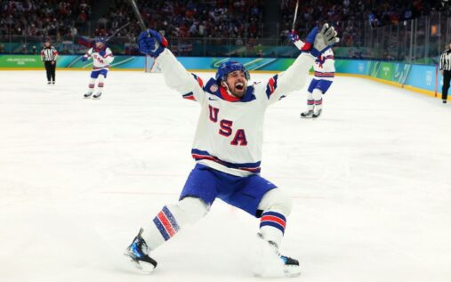 USA players celebrate winning the men's ice hockey gold medal at the 2026 Winter Olympics in Milan