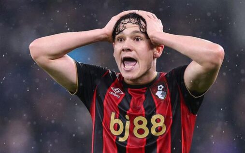A Premier League football shirt featuring a betting sponsor logo on the sleeve during a match