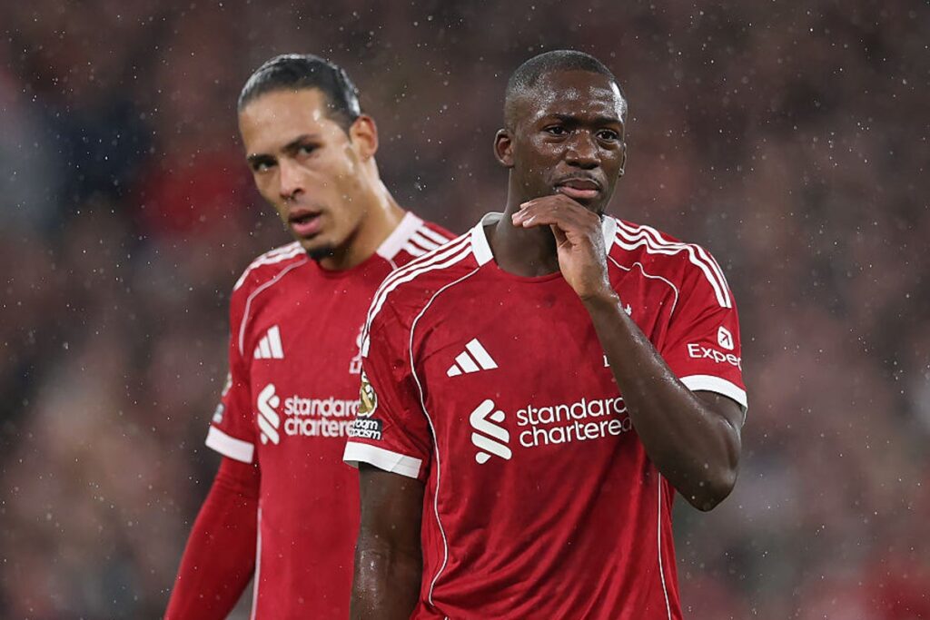 Virgil van Dijk gesturing on the pitch while standing next to teammate Ibrahima Konate during a Liverpool match