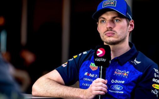 Max Verstappen speaking to the media in Red Bull Racing teamwear