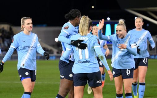 Manchester City players celebrating a goal against Leicester City in the Women's Super League