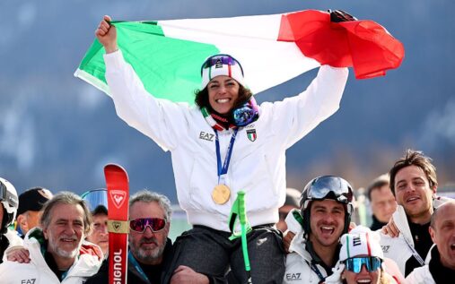 Federica Brignone celebrating in the finish area after winning the women's super-G at the Winter Olympics