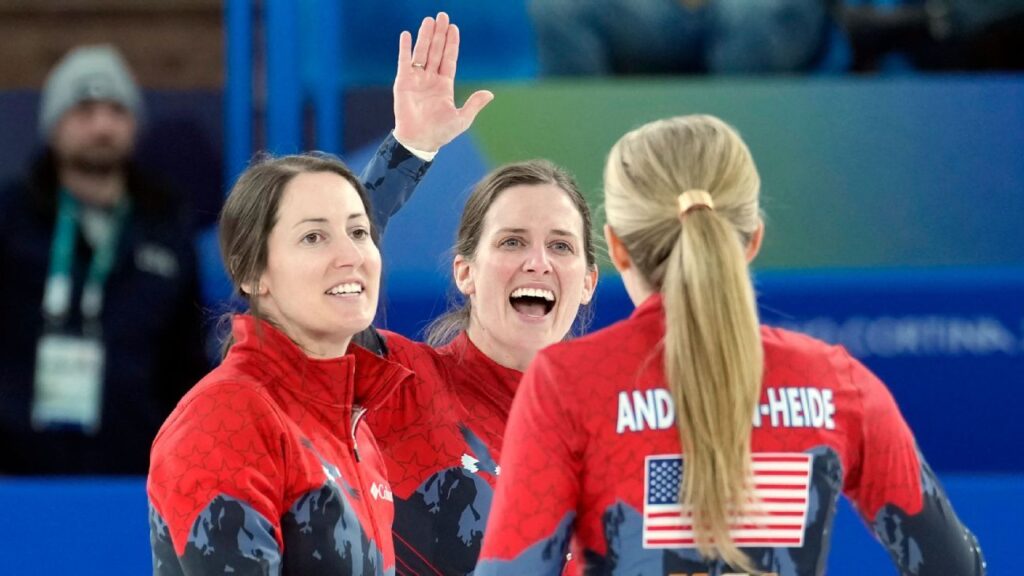The US women's curling team celebrating on the ice after defeating Canada at the Winter Olympics