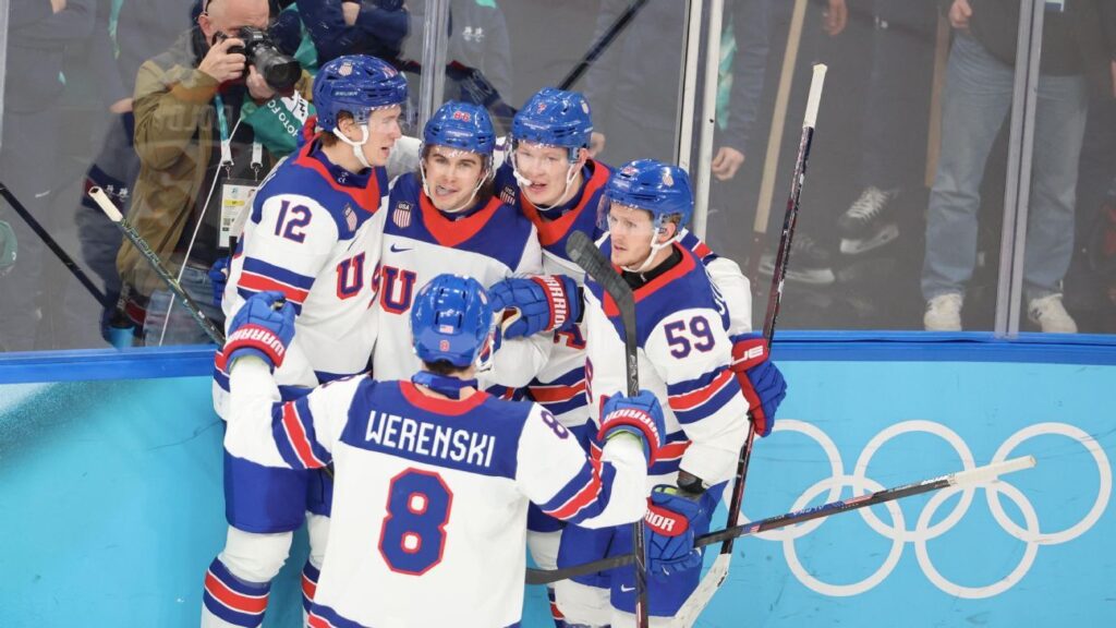 Jack Hughes celebrating a goal for Team USA during the Winter Olympics ice hockey semi-final against Slovakia