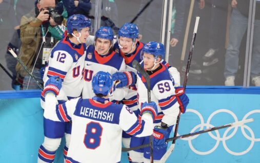 Jack Hughes celebrating a goal for Team USA during the Winter Olympics ice hockey semi-final against Slovakia