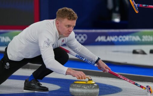 Great Britain's Bobby Lammie delivering a stone during a Winter Olympics curling match