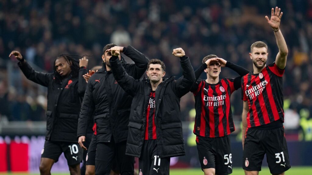 AC Milan players celebrating their crucial Serie A derby victory over Inter Milan