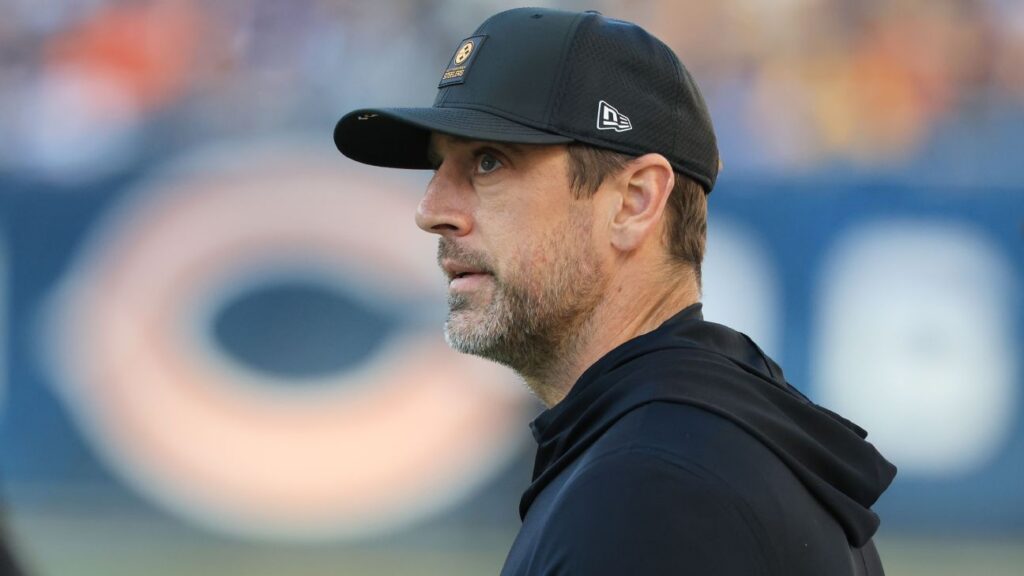 Aaron Rodgers looking contemplative while wearing a Pittsburgh Steelers uniform during a game